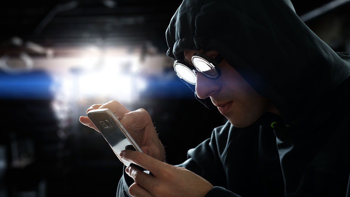 hacker with smartphone