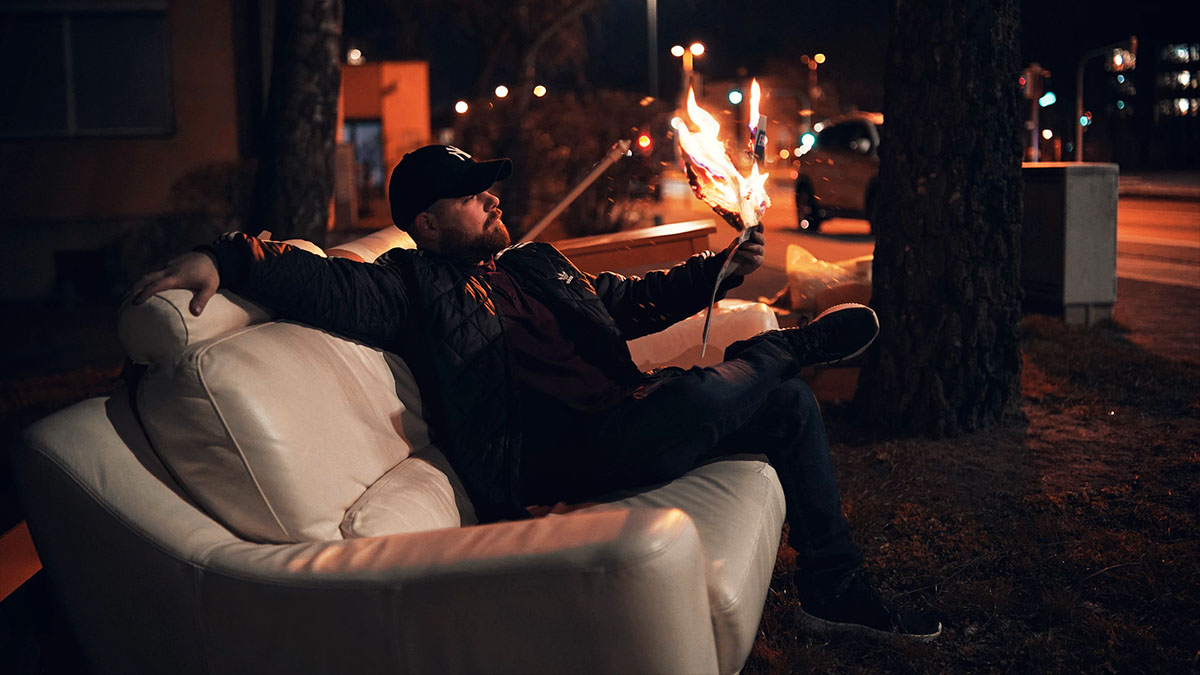 man reading paper on fire