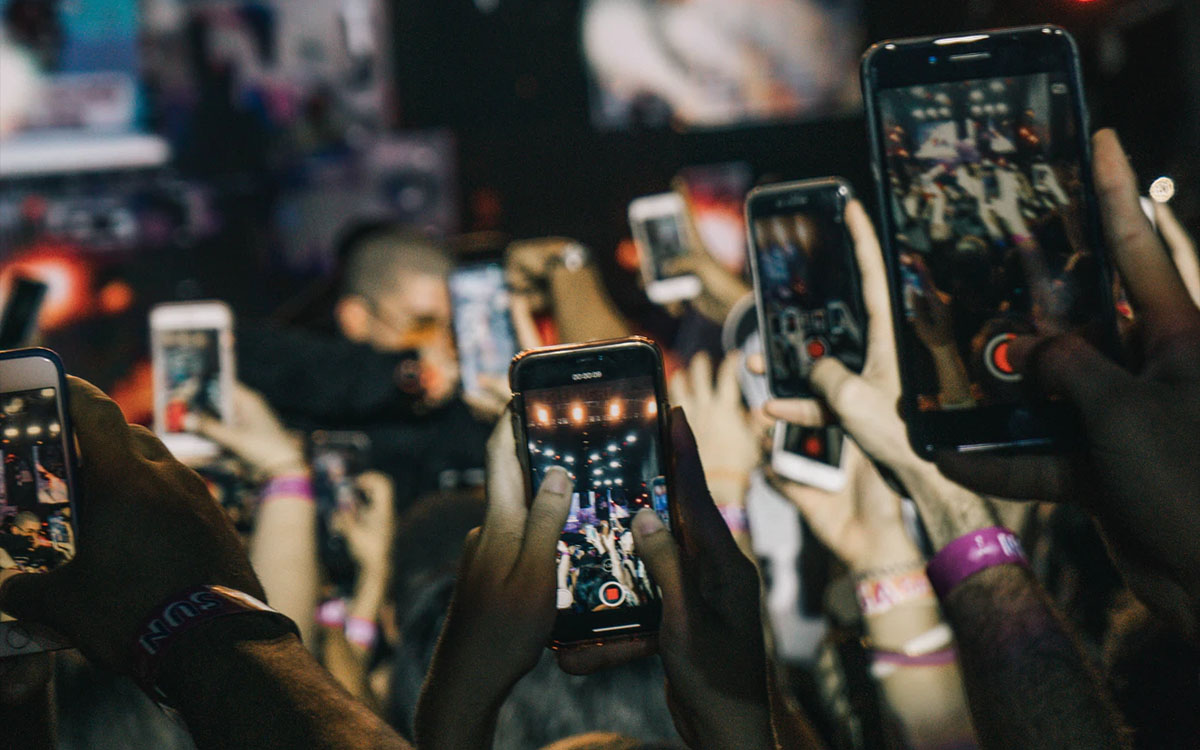 people recording on smartphones