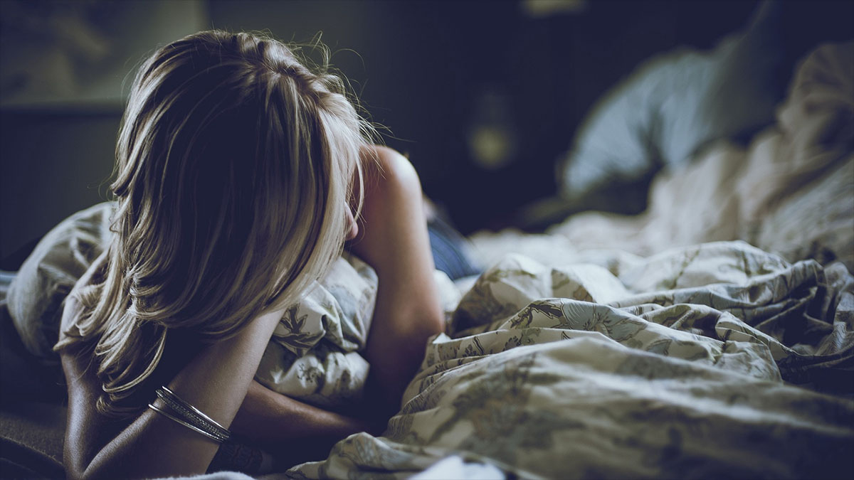 woman in messy bed